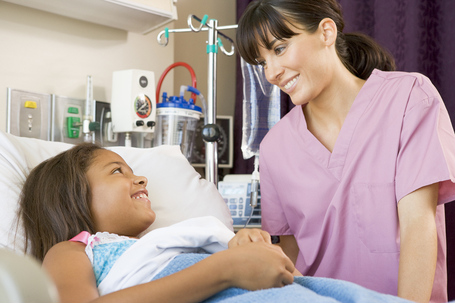 Nurse Talking To Young Patient