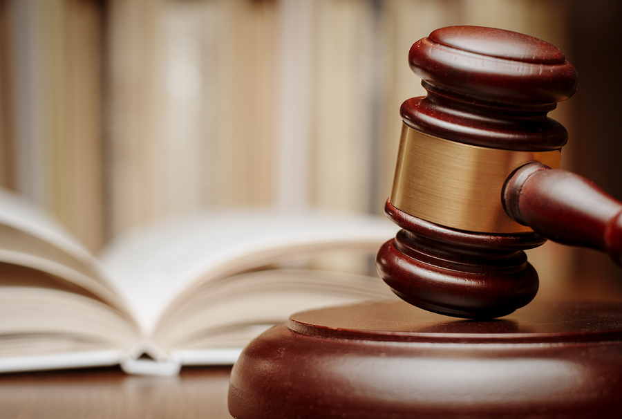 Wooden Gavel In Front Of An Open Law Book overtime rule