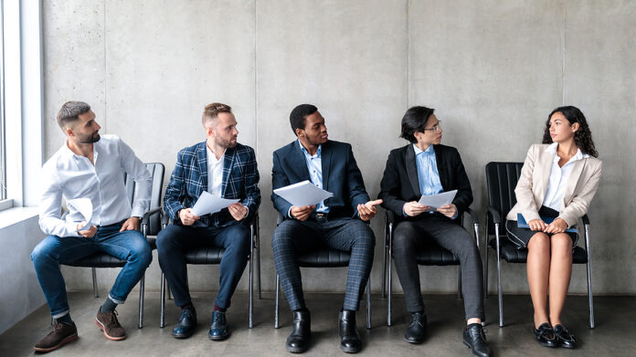 Employment Discrimination. Diverse Businessmen Staring At Lady A