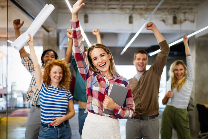 Successful Company With Happy Employees In Modern Office