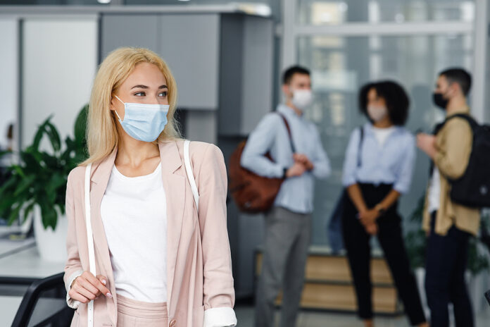 Return To Work After Lockdown And New Normal. Woman In Protectiv