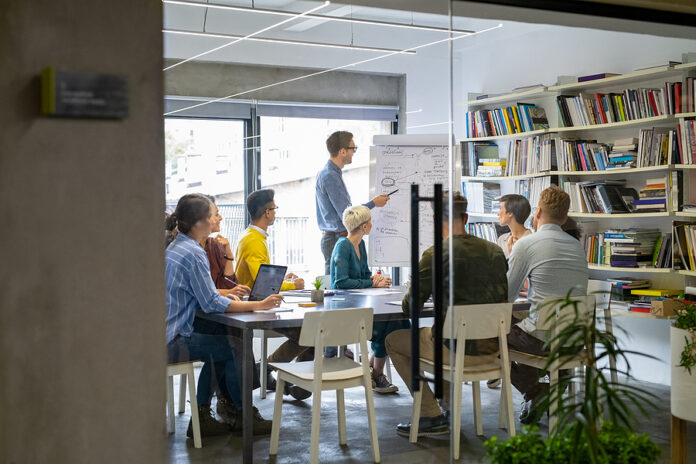 Businessman giving a presentation to multiethnic creative team a