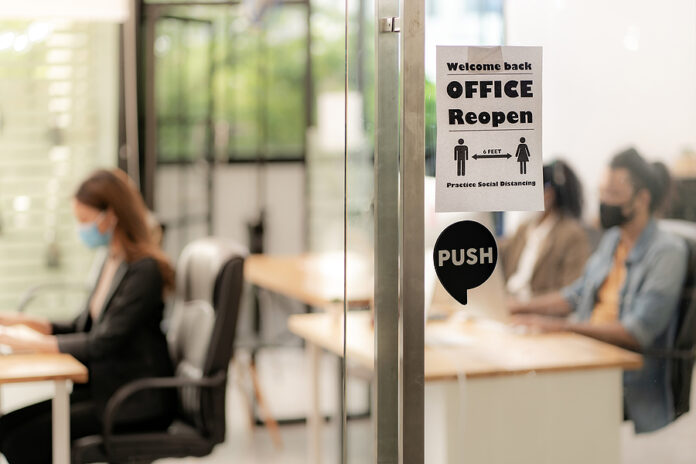 Signage of Office Reopen with social distancing practice with bl