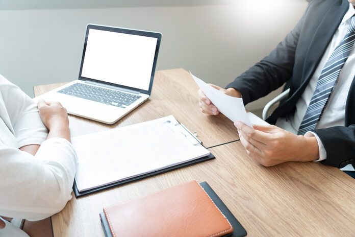 Business Consulting Candidate Employee In Suit Looking Skeptical