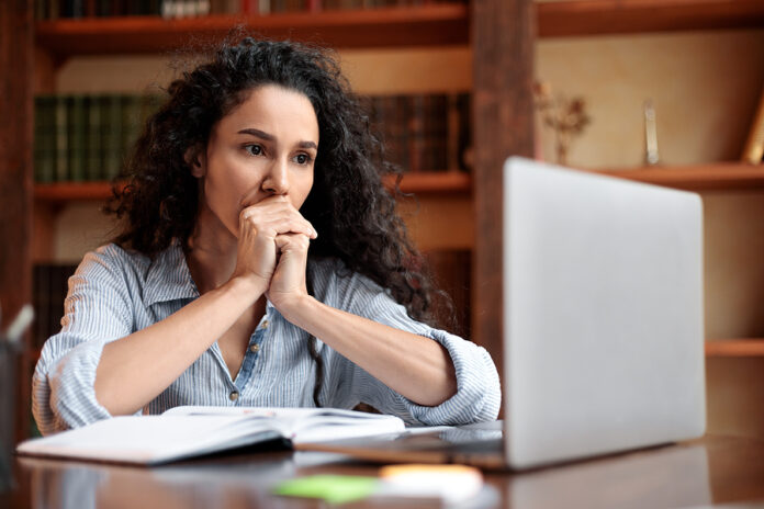 Freelance Stress. Concerned Female Freelancer Tired After Work O