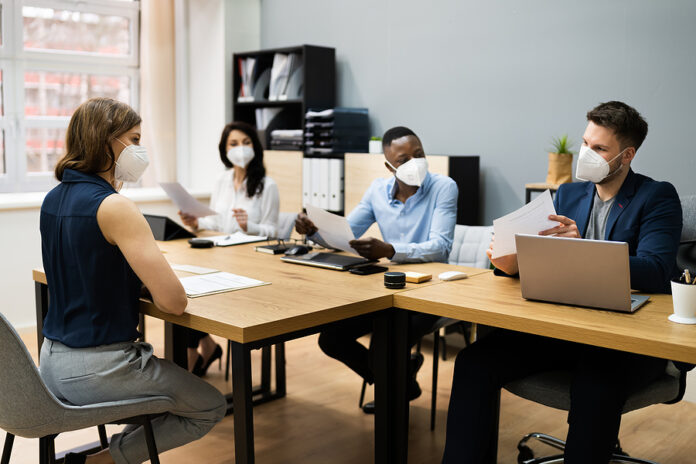 Business Manager Job Interview Talking In Face Mask