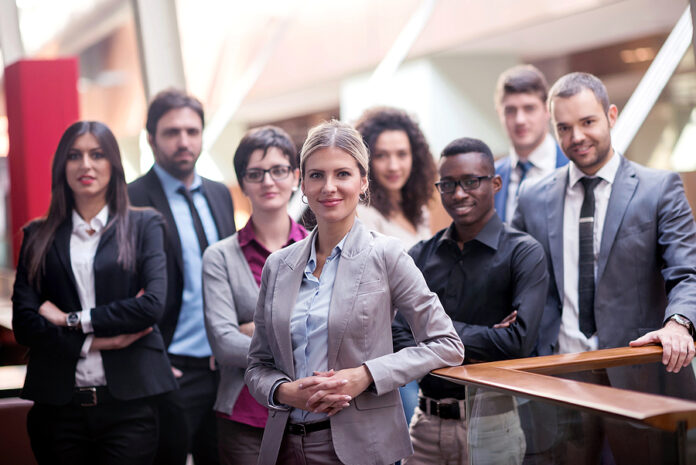 young multi ethnic business people group walking standing and to