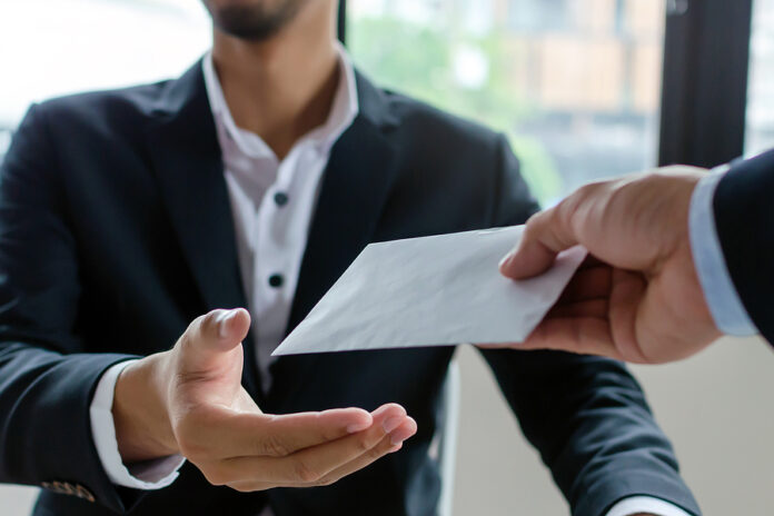 Leader Manager Giving Money Bonus In Paper Envelope To Business