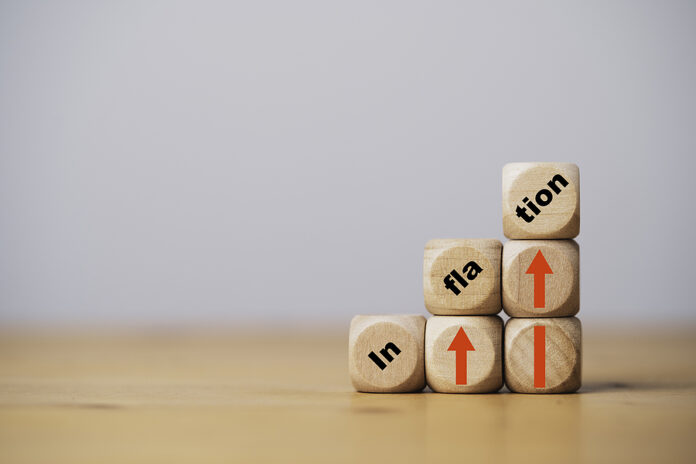 Inflation Wording Print Screen On Wooden Cube Block With Red Up