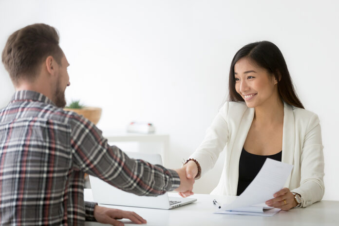 Smiling Asian Businesswoman Handshaking Businessman Hiring Candi