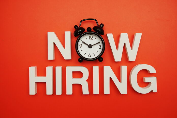 Now Hiring Alphabet Letters On Red Background
