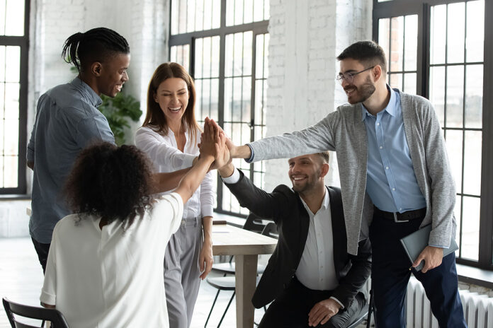 Overjoyed Diverse Businesspeople Engaged In Teambuilding Activit