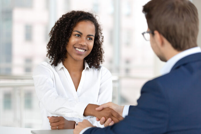 Smiling African Hr Manager Handshake Hire Candidate At Job Inter