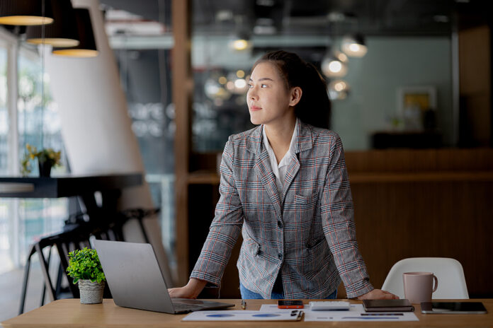 Portrait Of A Young Beautiful Asian Woman In A Office Room, Conc