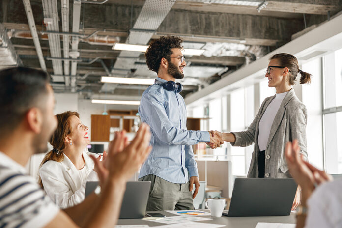 Smiling Female Boss Leader Shaking Hand Of New Team Member Recru