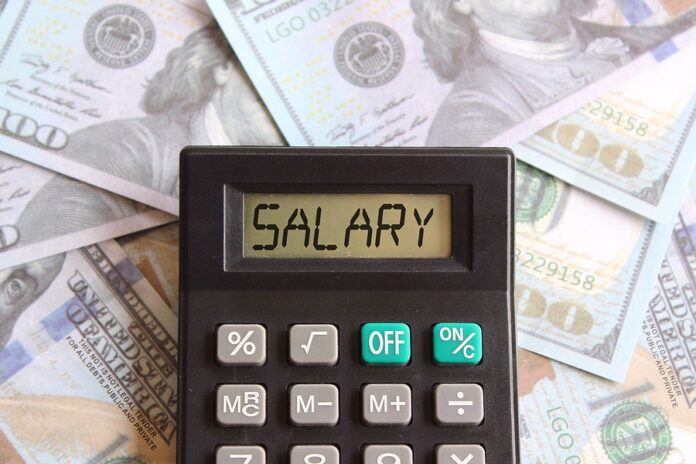 Top View Image Of Calculator With Text Salary And Money. Busines