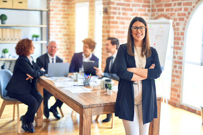 Group of business workers smiling happy and confident working to