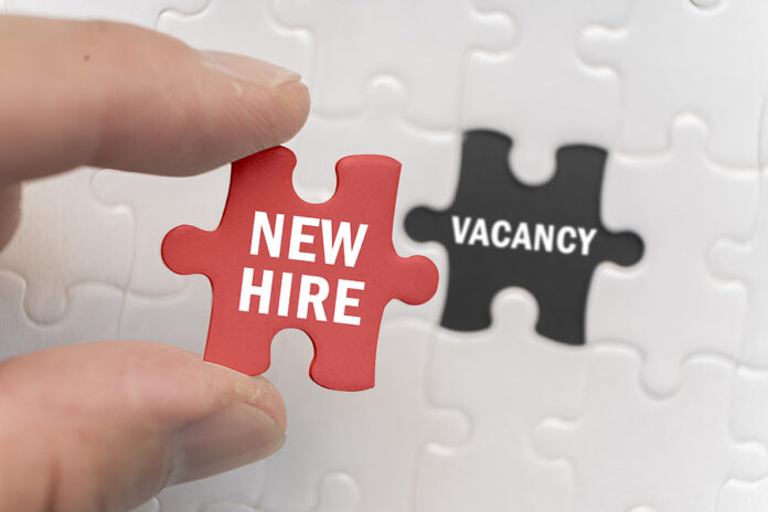 The New Hire Words On The Red Puzzle Pieces Fill Holes Or Positi