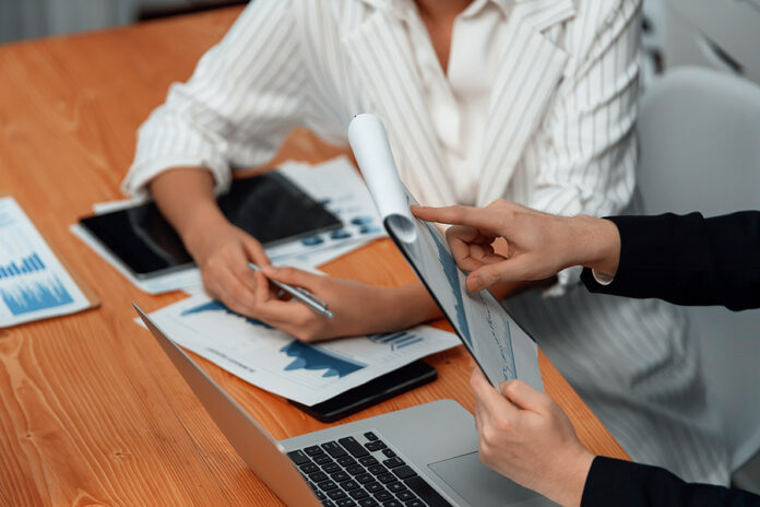Harmony In Office Concept As Business People Analyzing Dashboard