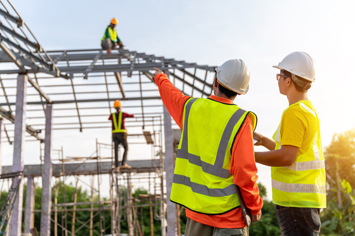 4 Workers In Construction Site, Industrial Building Construction