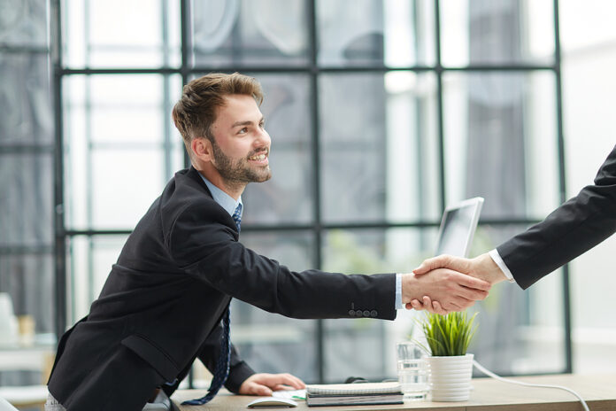 Hello By Man In Office, Indoor Waving Hand