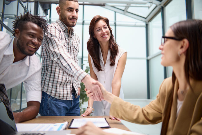 Manager Shaking The Hand Of A Female Applicant