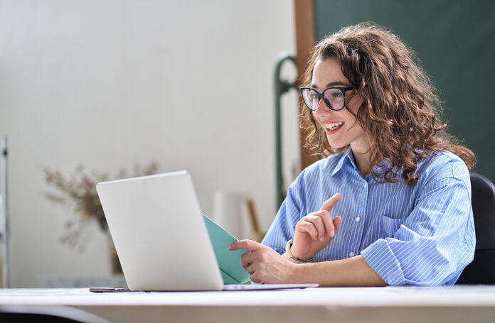 Young Business Woman Hr Manager Coach Looking At Laptop Talking