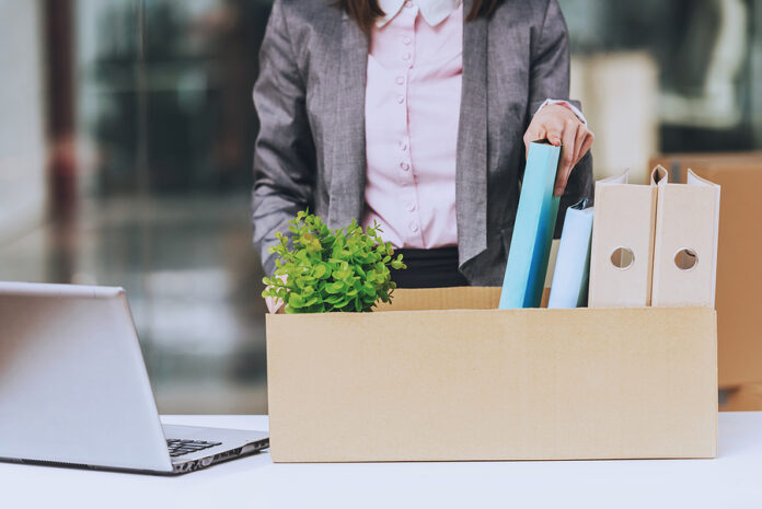 Business Woman Wraps Documents. Box For Moving. Young Manager In