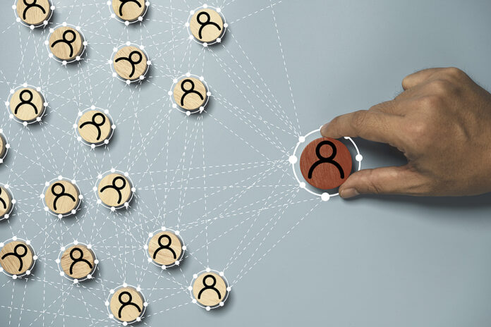 Hand Holding To Select Human Icon With Connection Linkage For Hu