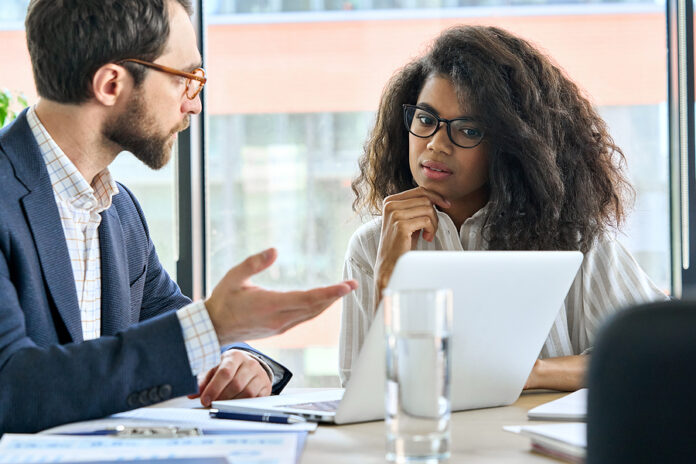 Male Mentor Executive Manager Leader Talking To Female African A