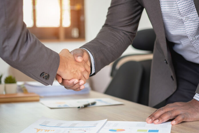 Satisfied Black Client Shaking Hands, Thanking The Manager For G