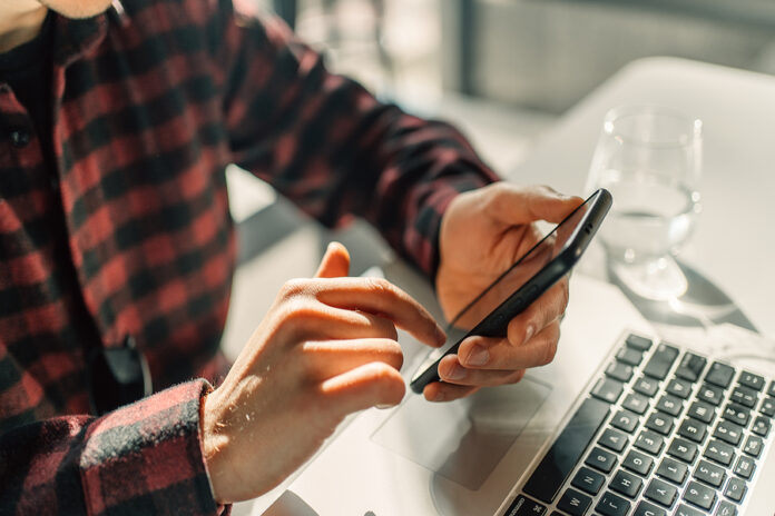 Young Businessman Student Worker Using Mobile Phone In Hands, Ma