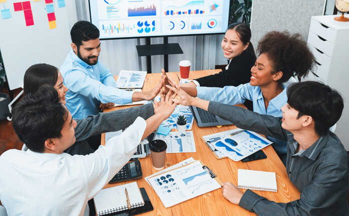 Diverse Business Team Celebrate Successful Meeting With High-fiv