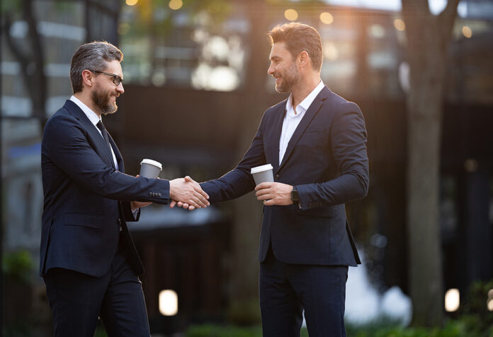 Image Of Two Business Partners Dealing Negotiation. Two Business