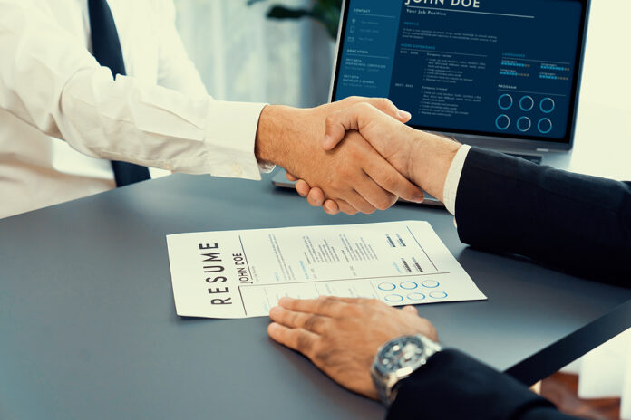 Successful Job Interview At Business Office With Handshake. Posi