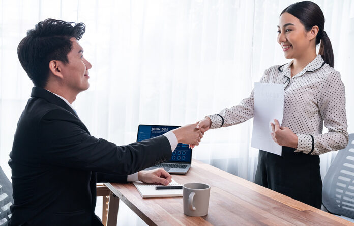 Happy Business People Shake Hands After Successful Meeting Or Jo