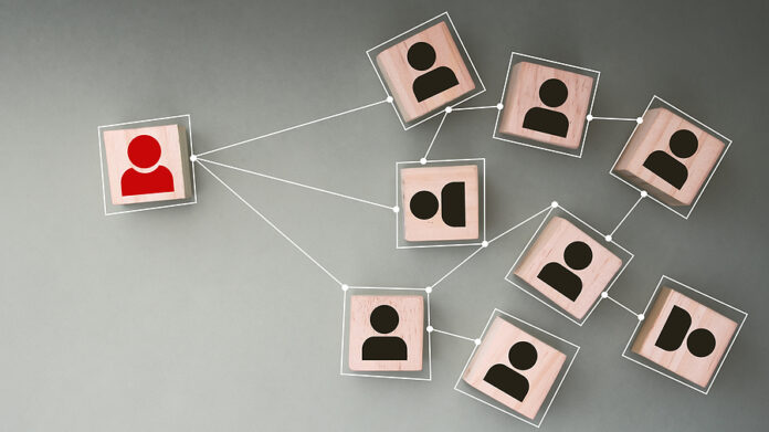 Wooden Cubes With White People Icon Connecting Network Of Connec