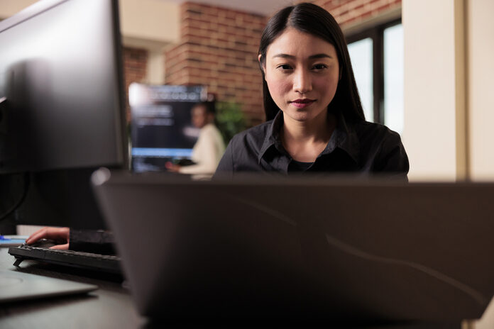 Asian Tech Enginner Analyzing Compiling Html Code On Computer Di