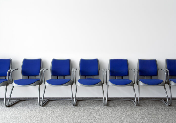 Blue chairs in ordinary empty waiting room