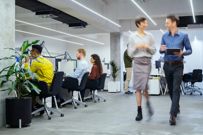 Group of businesspeople working in creative office. Interior of