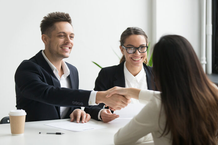 Smiling Hr Manager And Hired Female Applicant Won Job Interview
