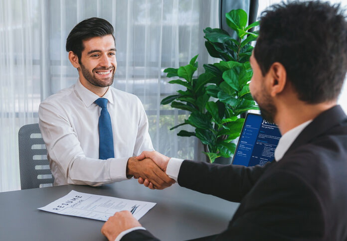 Successful Job Interview At Business Office With Handshake. Posi