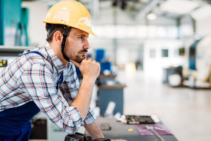 industrial factory worker working in metal manufacturing industry