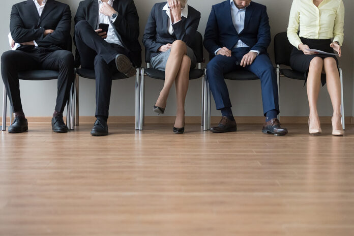 Businesspeople Legs Sitting In Chair In Queue Wait Job Interview
