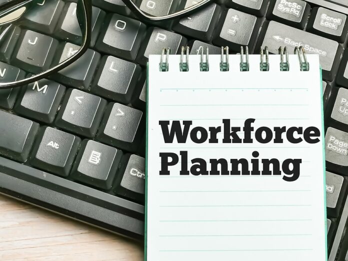 Phrase Workforce Planning Written On Note Book With Eye Glasses.