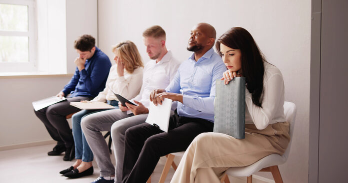 Business People Are Getting Bored While Sitting On Chair Waiting