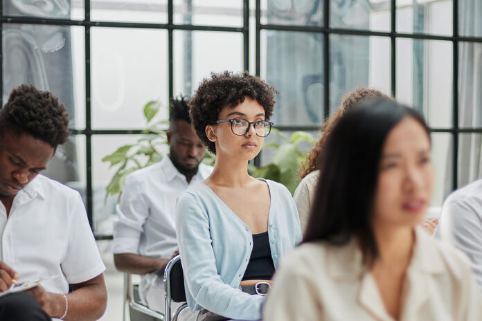 Diverse People Participating In A Group Business Training Sessio
