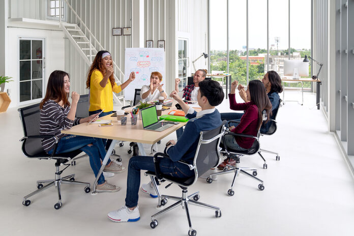 Group Of Young Attractive Asian Creative Design Team Meeting At