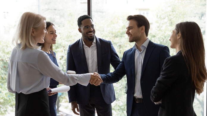 Diverse Businesspeople Handshake Getting Acquainted In Office