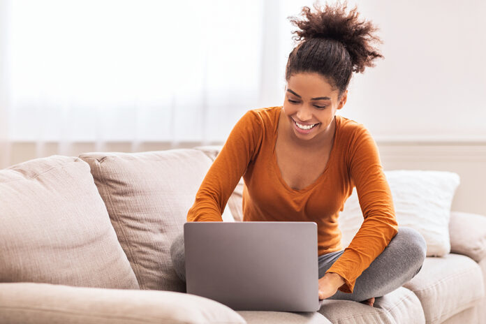 Happy African American Lady Freelancer Using Laptop Working Onli